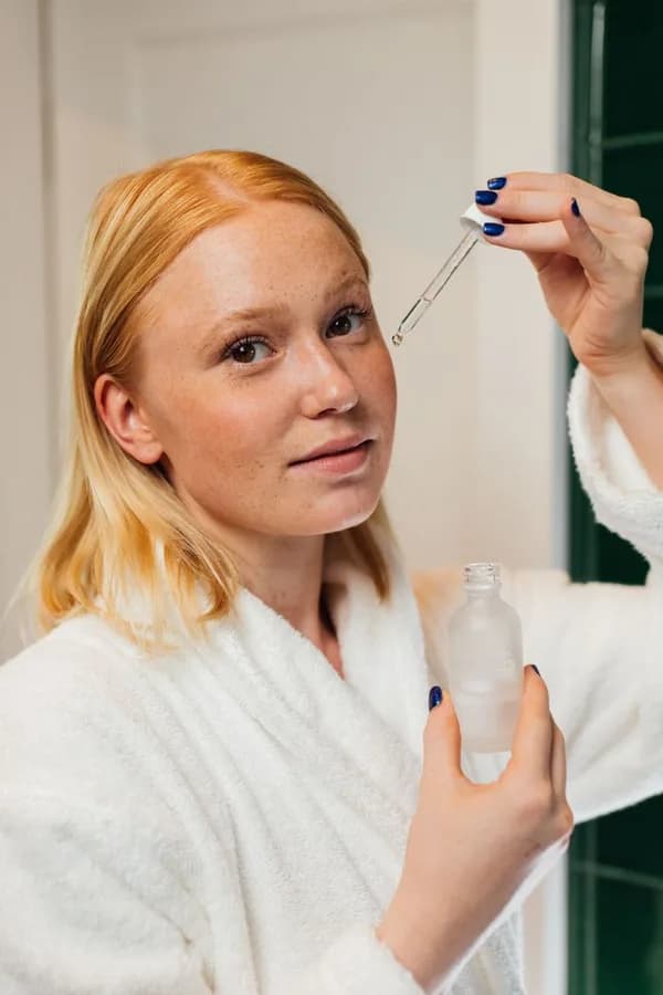 A creator demonstrating a skincare product